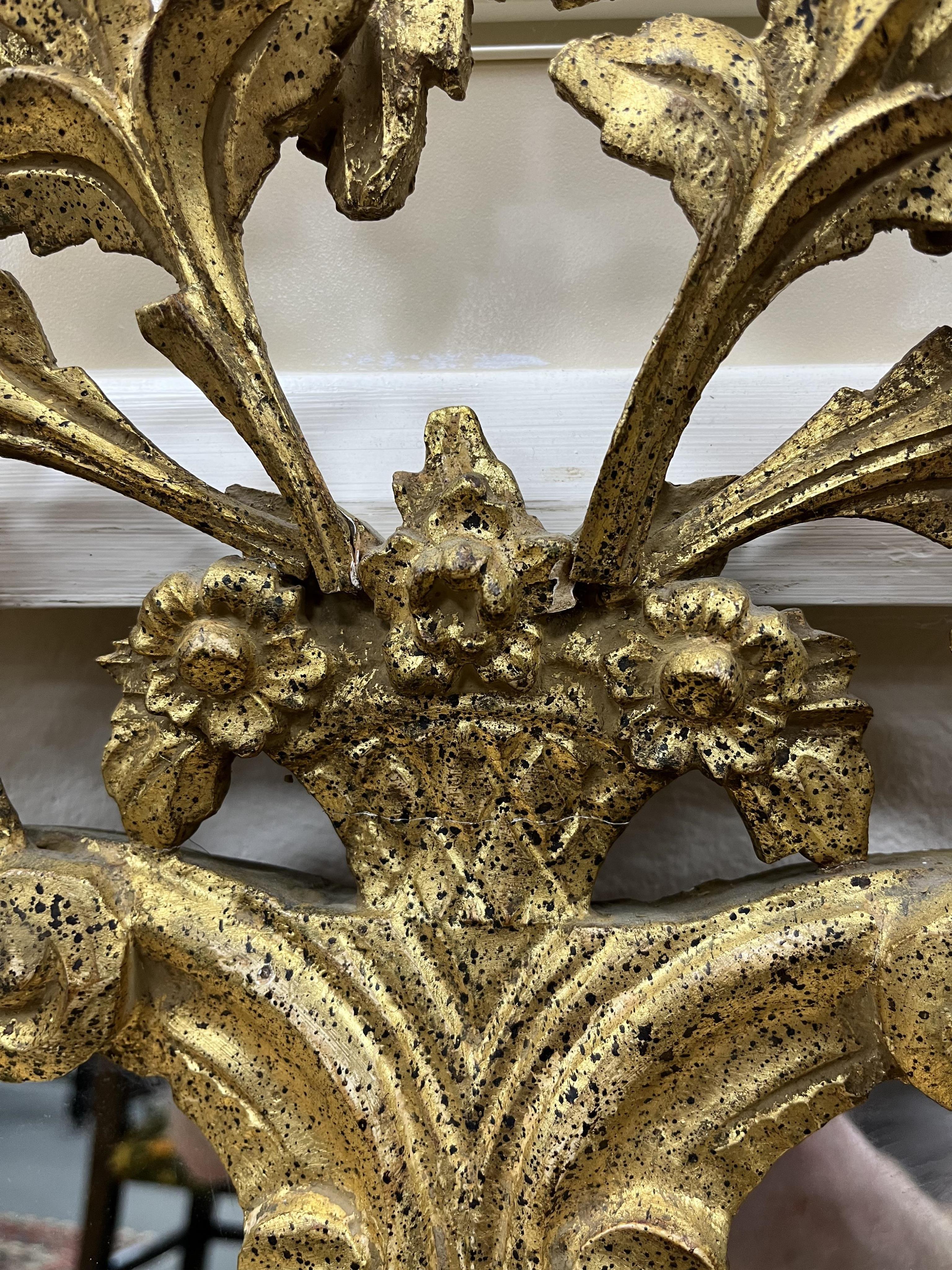 A George III style gilt wood and composition wall mirror, width 126cm, height 106cm.